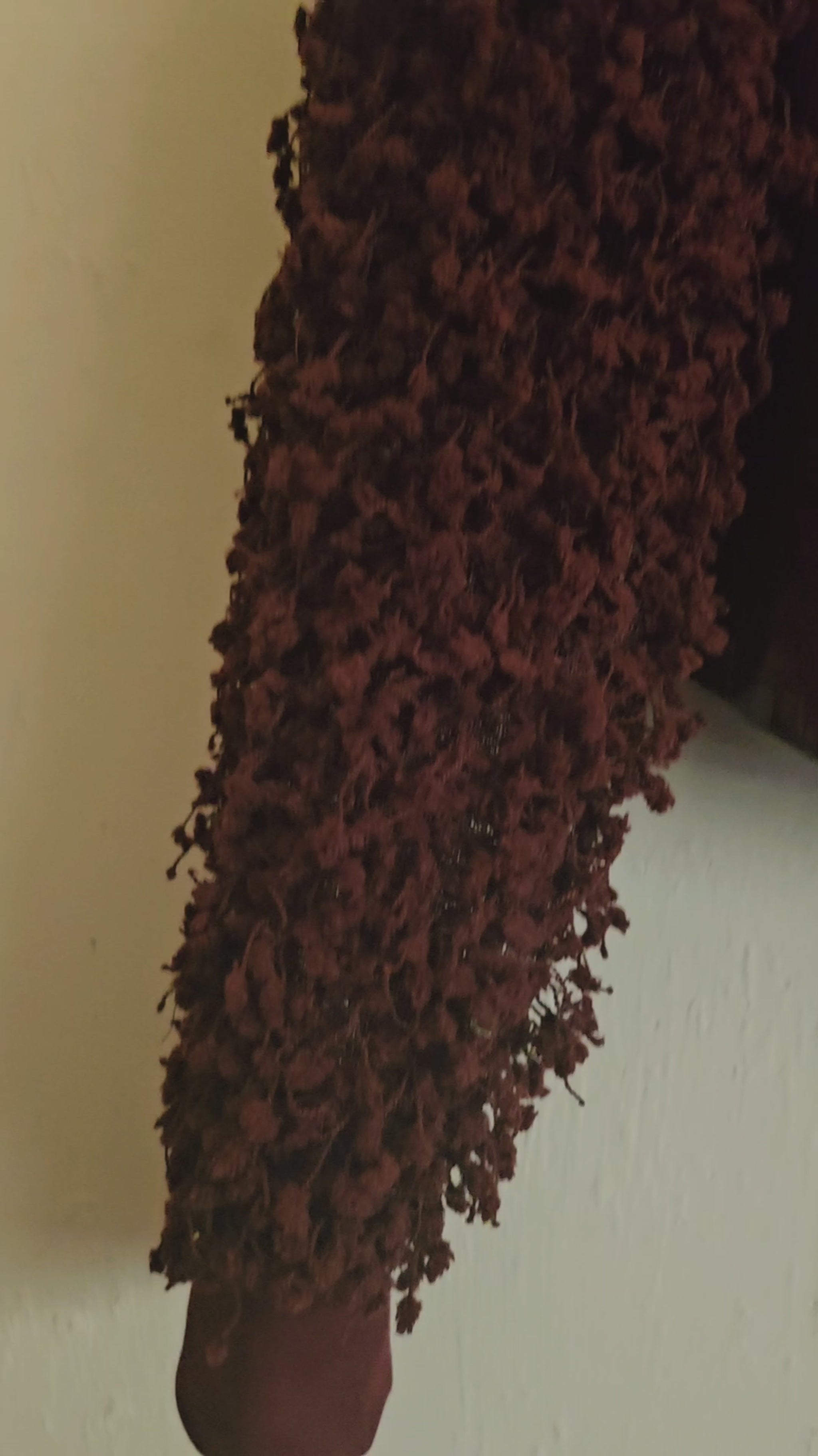 Video of burgundy croc embossed cropped jacket with fringe knit sleeves