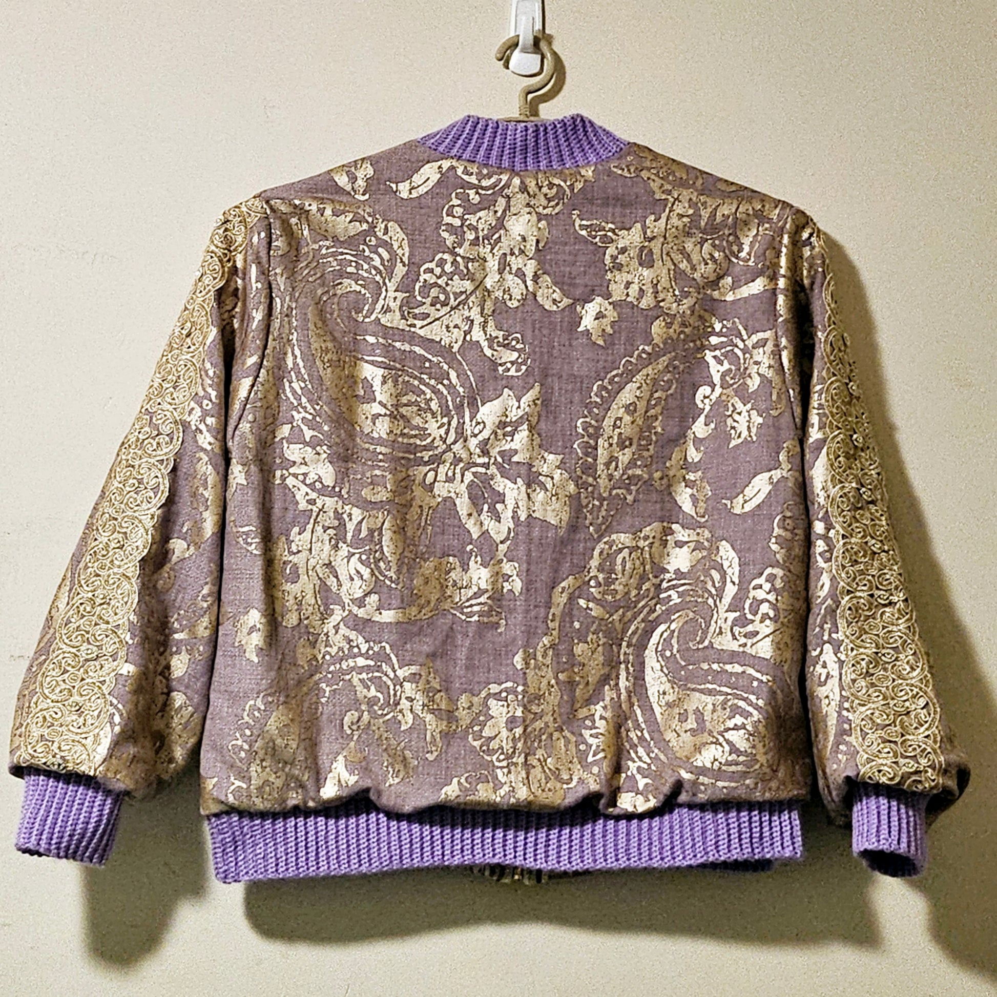 Back view of Lilac linen blend embossed with a golden baroque pattern