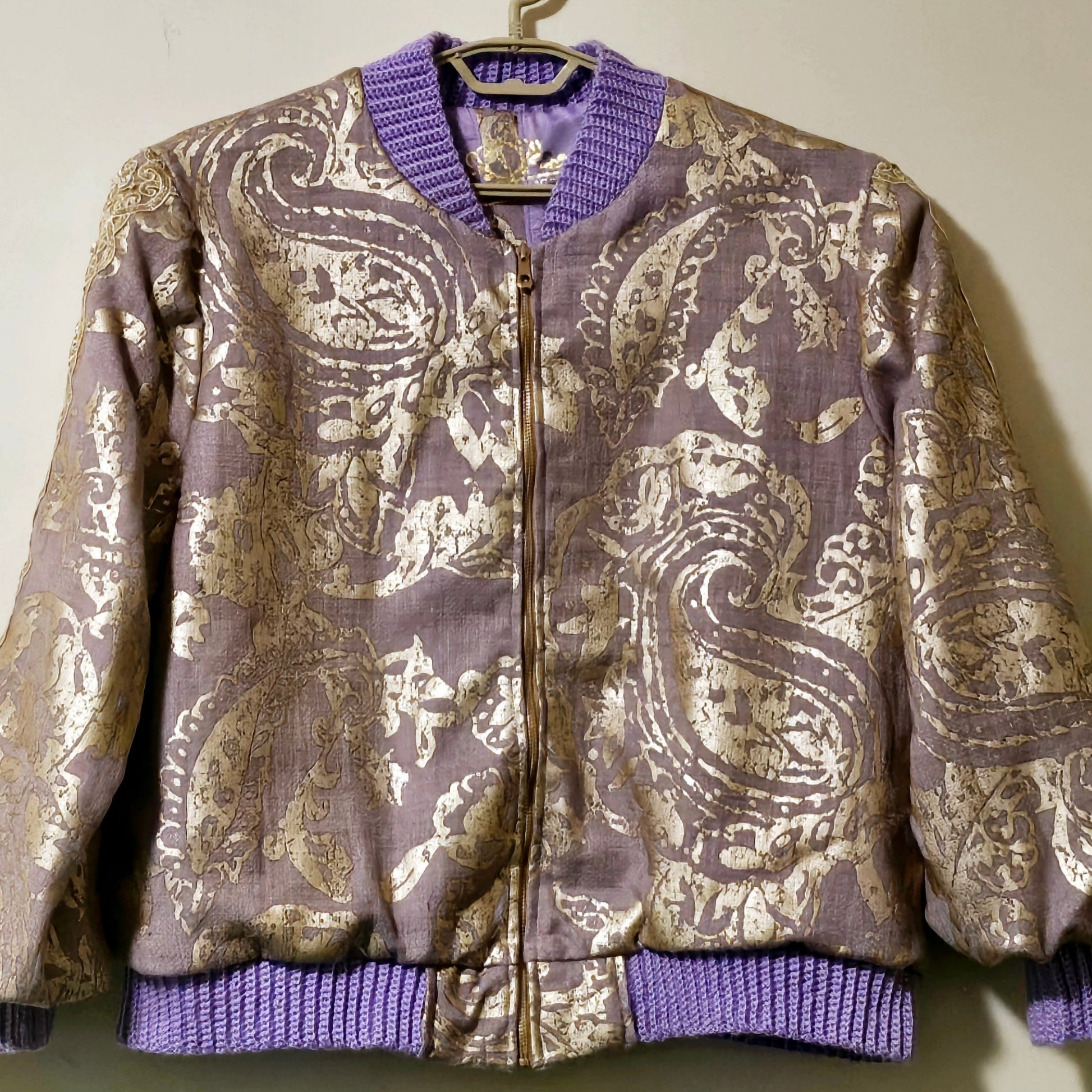 Front view of Lilac linen blend embossed with a golden baroque pattern