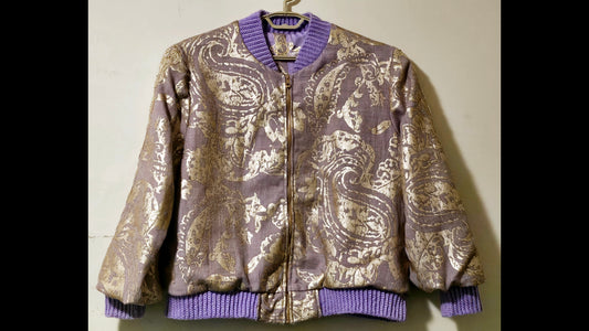 Front view of Lilac linen blend embossed with a golden baroque pattern