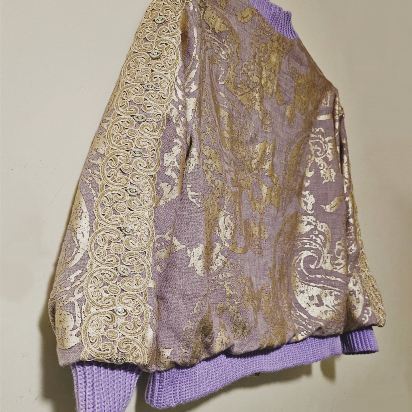 Side back view of Lilac linen blend embossed with a golden baroque pattern