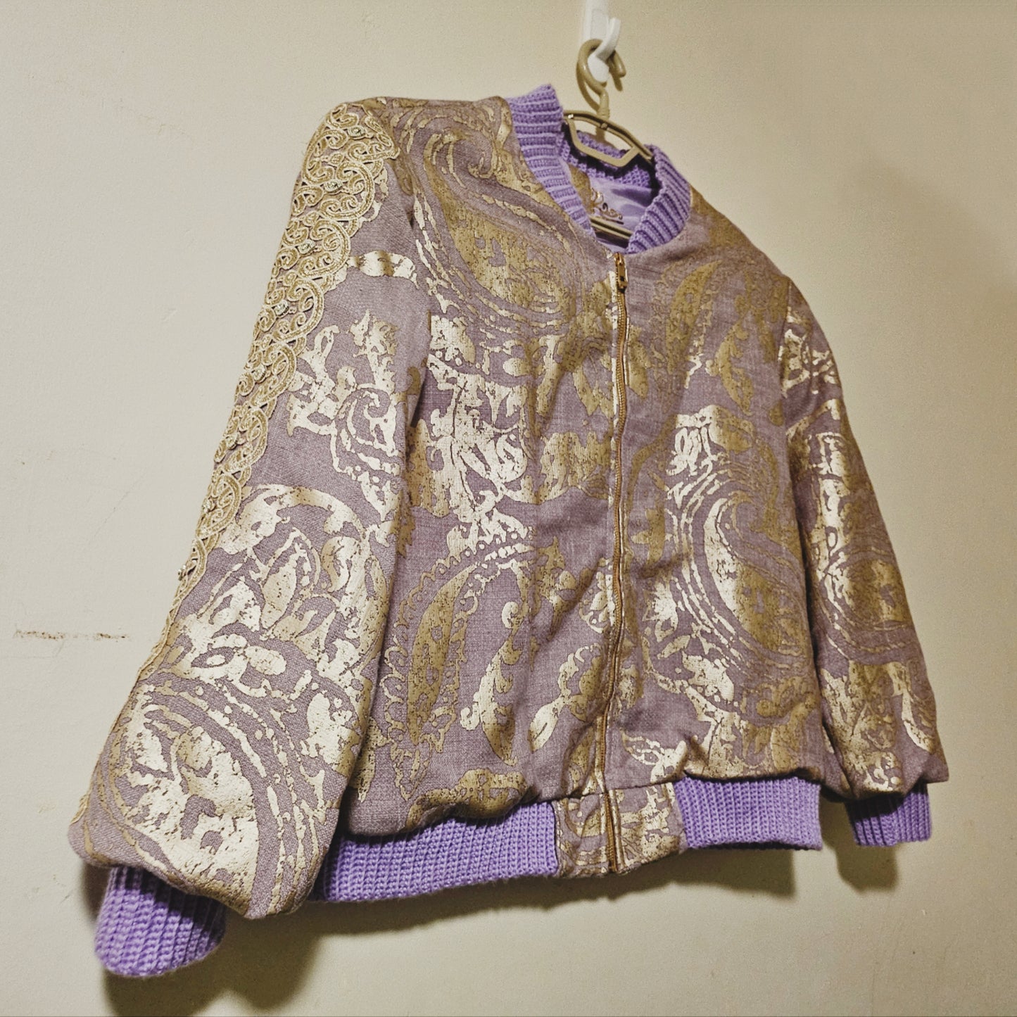 Side Front view of Lilac linen blend embossed with a golden baroque pattern
