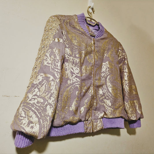 Side Front view of Lilac linen blend embossed with a golden baroque pattern