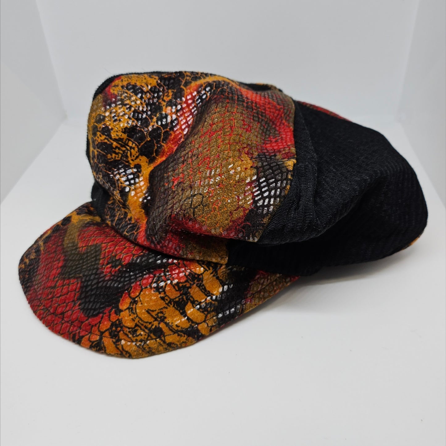 close up view of Burnt orange animal print hat and purse set