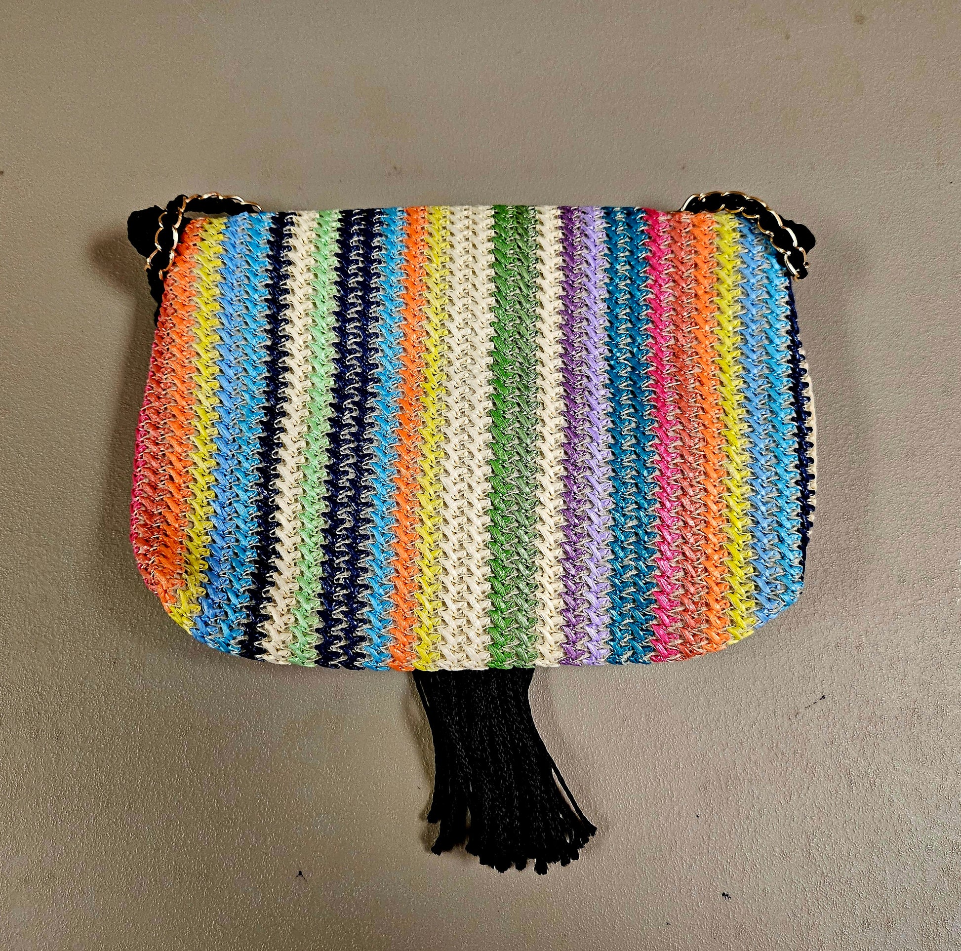 top back view of Rainbow striped crossbody with decorative tassel 