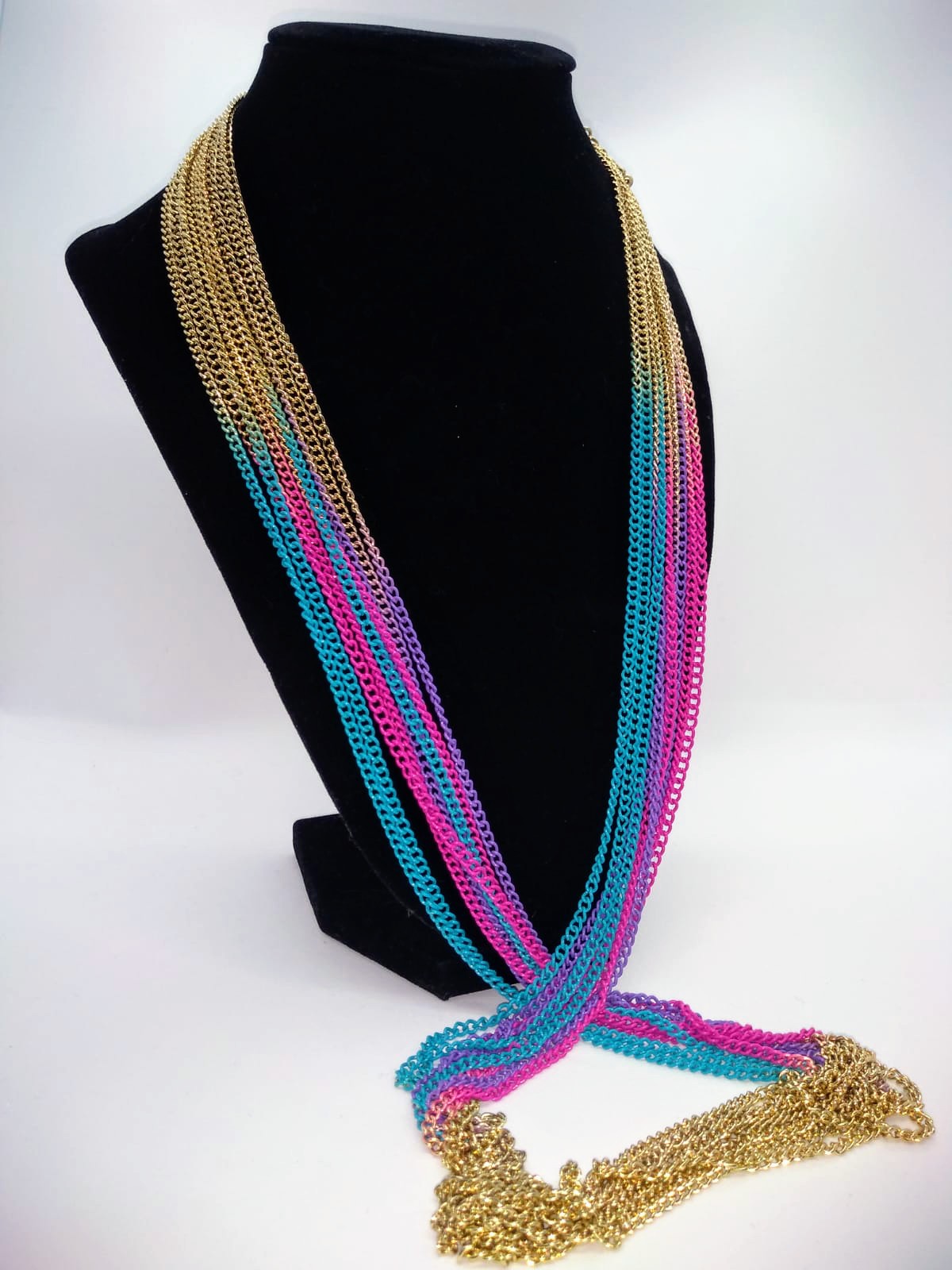 gold chain, with multi color accents on black stand