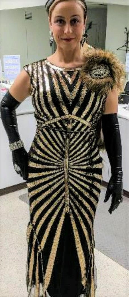 Art Deco-inspired beaded gown with detachable faux fur stole and appliques on model