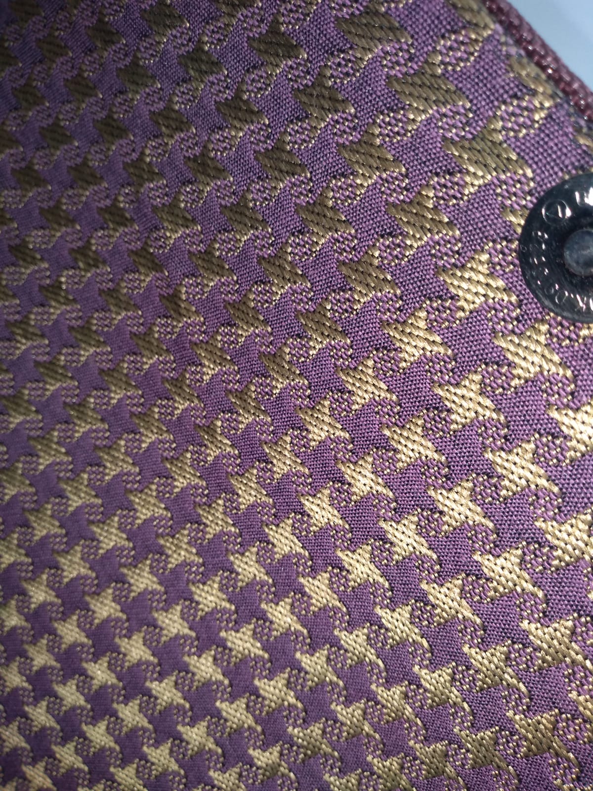 gold and purple hounds tooth lining of brown wood clutch
