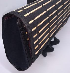 Side view of black wood clutch.