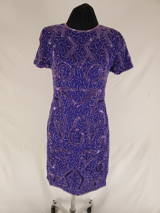 front view of 80s Purple Beaded Gown on mannequin